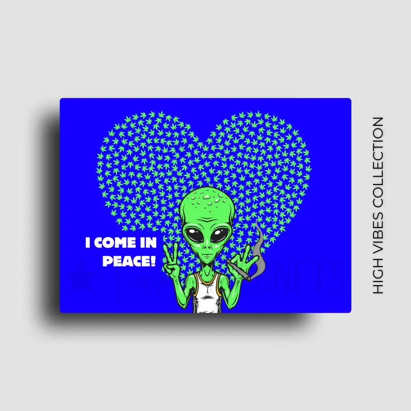Funny cannabis novelty fridge magnet with green alien with 'I Come in Peace!' text against a blue background with a heart shaped weed leaf pattern. Designed by Ink and Magnets.