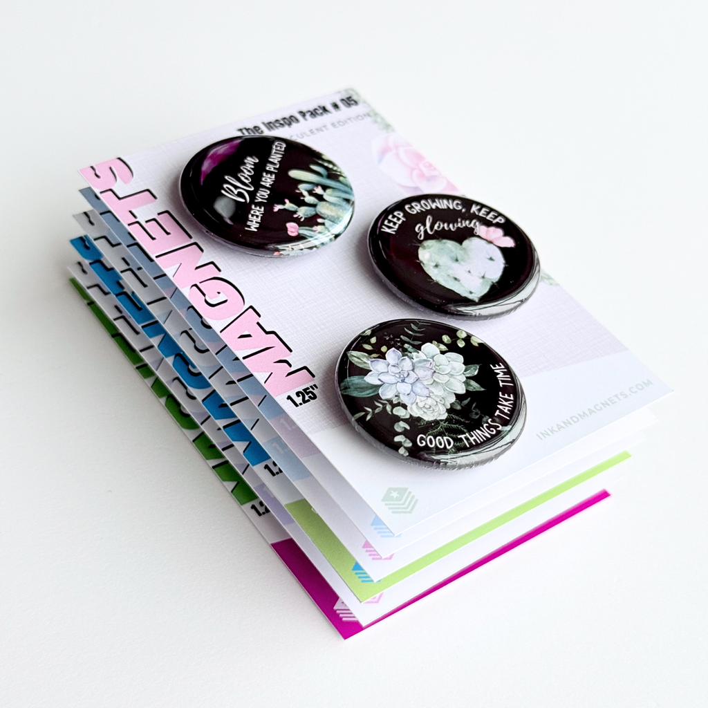 Round button magnets featuring matching succulent designs with motivational messages on a black background.
