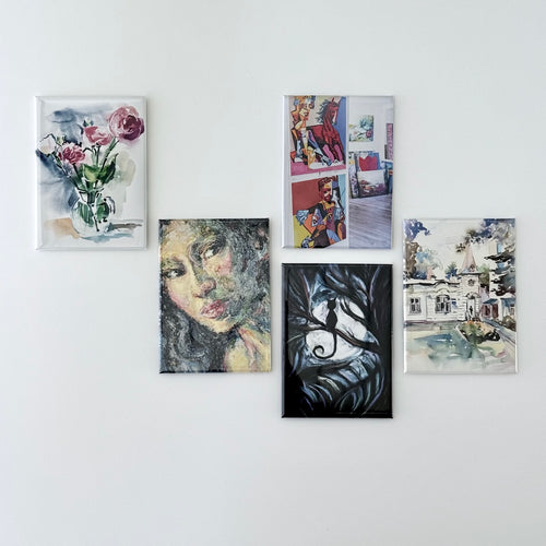 Custom artwork magnets featuring artist prints displayed on a white background showing small art pieces turned into magnetic prints