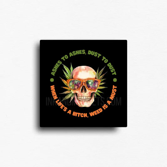 Ashes to ashes dust to dust cannabis novelty magnet with skull wearing sunglasses and leaf design, square button magnet.