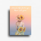 Fridge magnet showing Sunset watercolor woman with sunflowers. Inspirational novelty magnet that reads "wherever life plants you bloom with grace."
