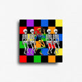 Bold Pride art magnet featuring a vibrant rainbow skeleton dancing among black-and-white skeletons on a colorful checkerboard background. Decorative square LGBTQ+ artwork for refrigerators, lockers, office file cabinets, magnetic boards, dorm rooms, and creative spaces.