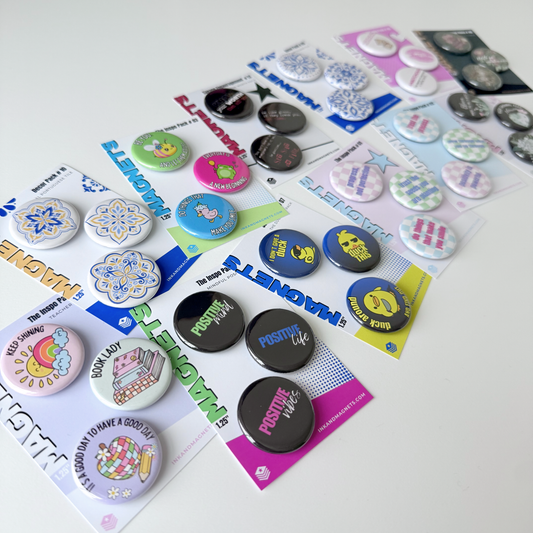 1.25" button magnets in a variety of design packs. Sold in sets of 3 pieces. This collection features curated sets with packs from 1-12. Find some inspirational, savage, or purely decorative messages and designs. 