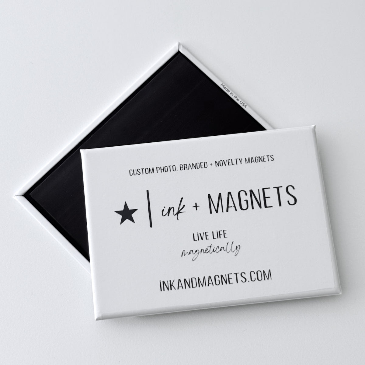 button magnet front and back display of quality by ink and magnets—custom photo, branded, and novelty magnets. Live life magnetically.