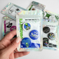 Cannabis button magnet pack featuring alien and high vibes designs, small round magnets shown in packaging as a 420 friendly fridge set.