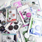 Collection of cannabis button magnet packs featuring 420 themed novelty designs, displayed in retail packaging as assorted fridge magnet sets