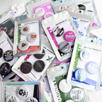 Collection of cannabis button magnet packs featuring 420 themed novelty designs, displayed in retail packaging as assorted fridge magnet sets