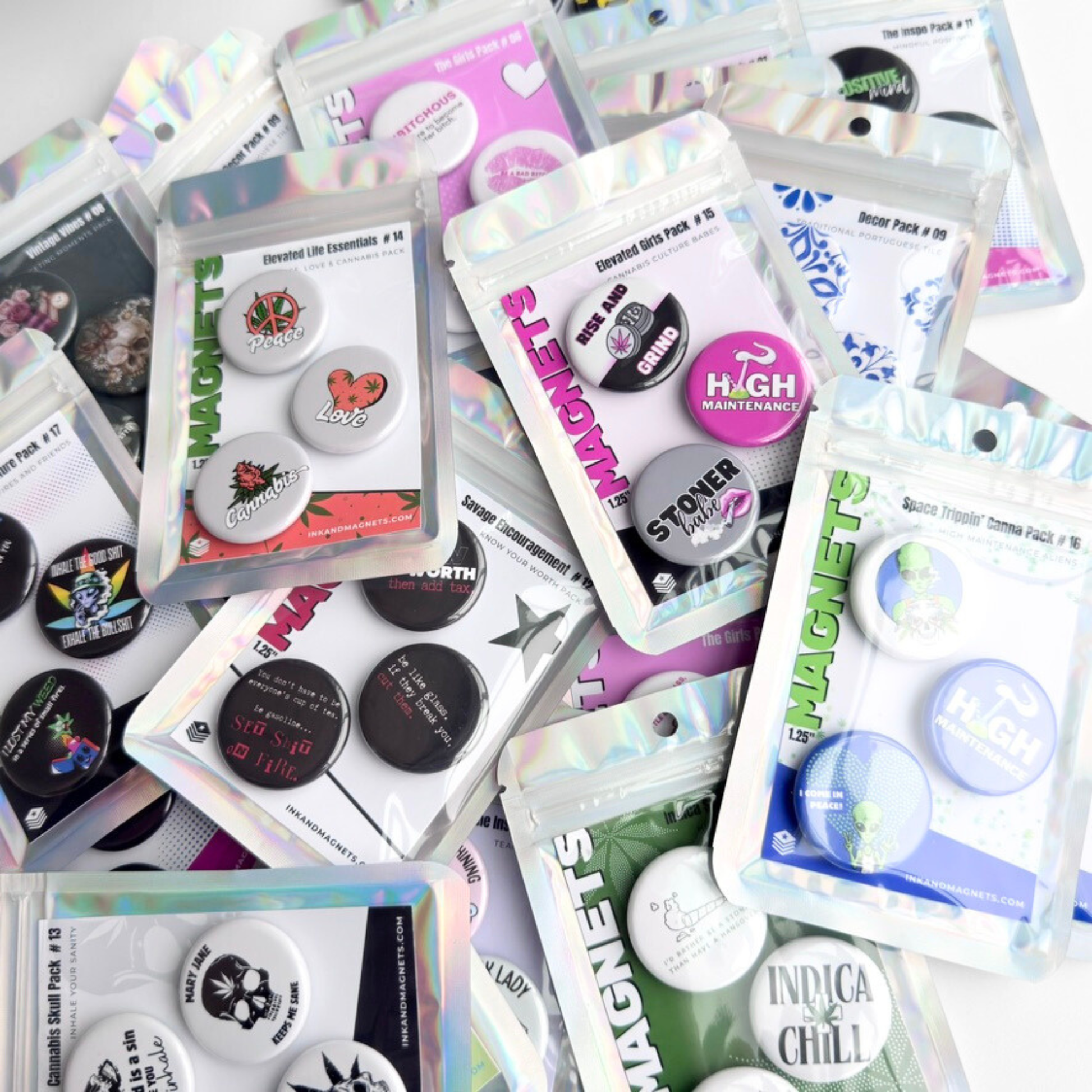 Collection of cannabis button magnet packs featuring 420 themed novelty designs, displayed in retail packaging as assorted fridge magnet sets