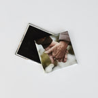 Closed corner square button magnets displaying the front and back of custom photo magnets. Front features a sentimental personalized image of a couple holding hands.