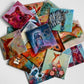 A collection of vibrant art magnets by a local artist featuring colorful animal illustrations on 2.5" square button magnets. 