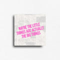 Encouragement quote fridge magnet featuring the inspirational message, "Maybe the little things are actually the big things," in bold pink typography over a modern newspaper-inspired collage background. Thoughtful minimalist décor for refrigerators, lockers, office file cabinets, and magnetic boards.
