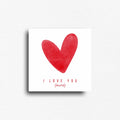 Novelty magnet with white background large red watercolor heart with the words " I love you (more)" Gift to someone that needs a reminder of how much you love them.