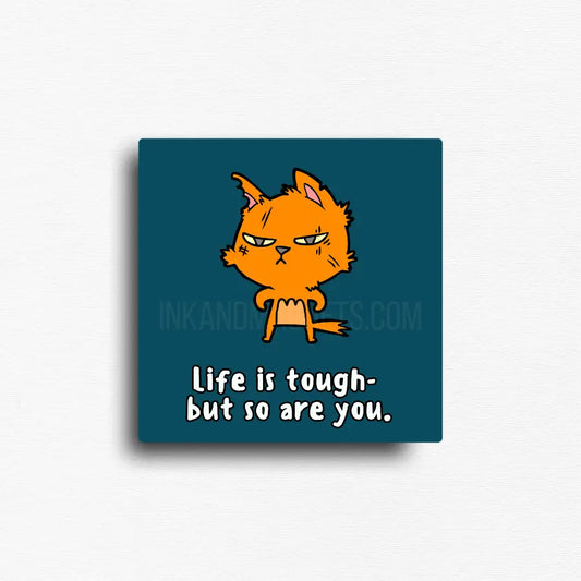 Motivational novelty fridge magnet of a roughed up cartoon cat reminding you that "life is tough- but so are you"