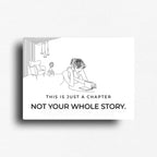 "this is just a chapter, not your whole story." novelty magnet with feminine line art of w woman reading a book. A reminder that we get to turn the page on our own lives. 