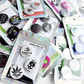 Assorted button magnet packs with novelty and cannabis themed designs, showing a variety of fun fridge magnets and packaging styles.