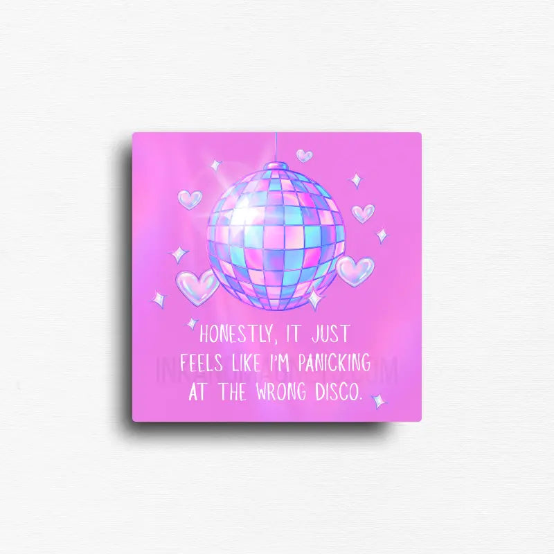 Square novelty fridge magnet featuring a pastel pink disco ball surrounded by hearts and sparkles with the phrase, "Honestly, it just feels like I'm panicking at the wrong disco." A humorous anxiety-themed magnet for refrigerators, lockers, office file cabinets, magnetic boards, and home décor.