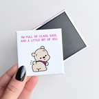 Funny novelty fridge magnet for girls with sass, with a cartoon bear and text held by a hand on a light gray background.