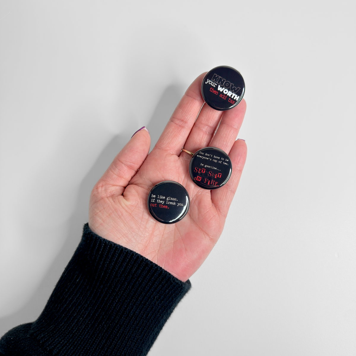 Savage encouragement button magnet pack with bold sarcastic quotes, small round magnets shown in hand as a funny motivational fridge set.