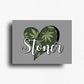 Cannabis themed novelty fridge magnet featuring a heart-shaped design with cannabis leaves and 'Stoner' text on a gray background. Custom design by ink and magnets available for wholesale orders.