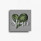 Novelty fridge magnet with heart-shaped design with cannabis leaves and 'Stoner' text on a gray background, custom square button magnet and design by ink and magnets available for wholesale orders.