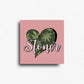 Cannabis themed novelty fridge magnet featuring a heart-shaped design with cannabis leaves and 'Stoner' text on a muave pink  background. Custom design by ink and magnets available for wholesale orders.