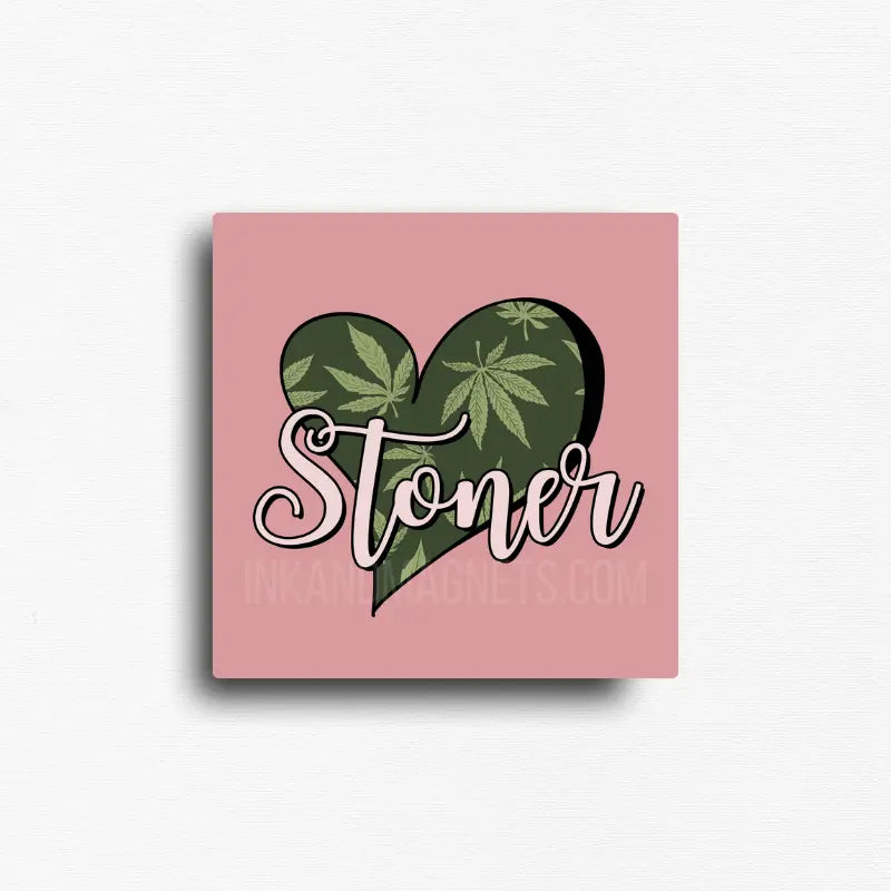 Cannabis themed novelty fridge magnet featuring a heart-shaped design with cannabis leaves and 'Stoner' text on a muave pink  background. Custom design by ink and magnets available for wholesale orders.