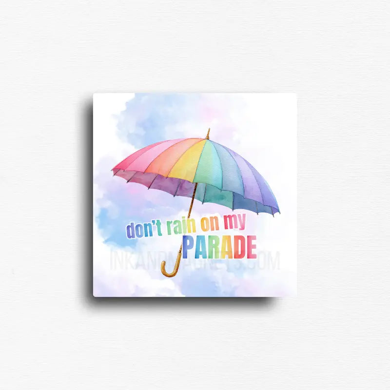 Square whimsical watercolor Pride magnet featuring a pastel rainbow umbrella above the phrase "Don't Rain on My Parade." Decorative LGBTQ+ magnet for refrigerators, lockers, office file cabinets, magnetic boards, classrooms, dorm rooms, and creative spaces.